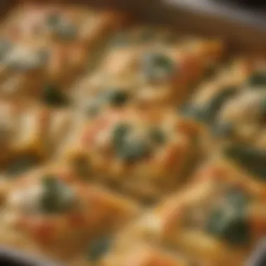 A close-up of baked spinach ravioli, highlighting its golden-brown exterior and melted cheese topping.