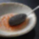 A stunning close-up of American sturgeon caviar glistening on a mother-of-pearl spoon