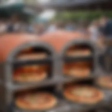 A selection of portable pizza ovens displayed in a vibrant outdoor market