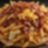 A close-up view of crispy bacon cheese fries topped with melted cheese and crispy bacon bits