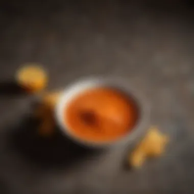 Mild Buffalo Sauce in a Bowl A rich bowl of mild buffalo sauce with a vibrant orange hue