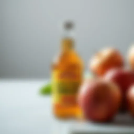 A bottle of apple cider vinegar with fresh apples