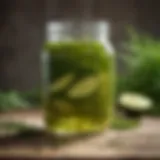 A close-up of a glass jar filled with vibrant dill pickle juice surrounded by fresh dill herbs.