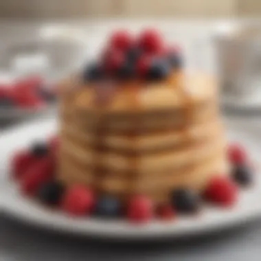 Fluffy pancakes drizzled with maple syrup and berries