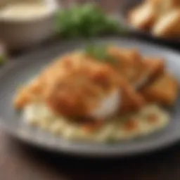 A beautifully plated dish of chicken coated with a crispy layer of bread crumbs and Parmesan, garnished with fresh herbs
