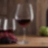 A glass of low carb dry red wine elegantly placed on a wooden table.