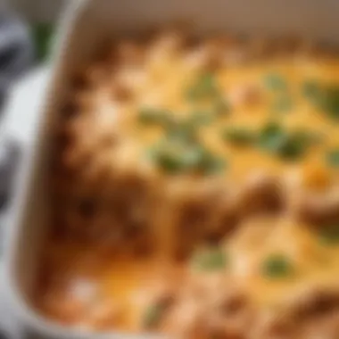 A close-up of bubbling cheese on a Mexican chicken casserole in a baking dish