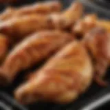 A close-up of seasoned chicken wings ready for the grill