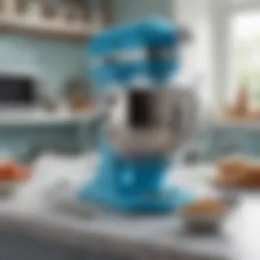 Artistic display of the light blue Kitchen Aid mixer with culinary ingredients