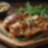 Sliced grilled chicken on a wooden board with herbs