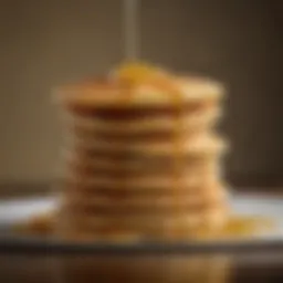 Perfectly golden pancakes stacked high with syrup drizzling down.