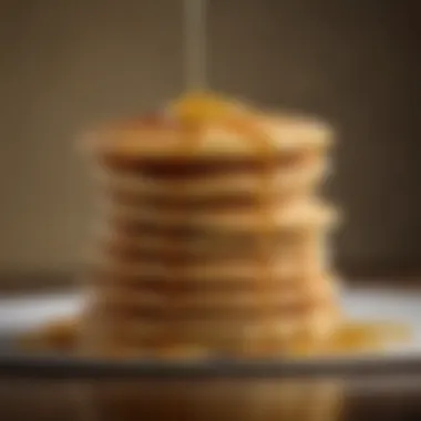 Golden Pancakes Stack Perfectly golden pancakes stacked high with syrup drizzling down.