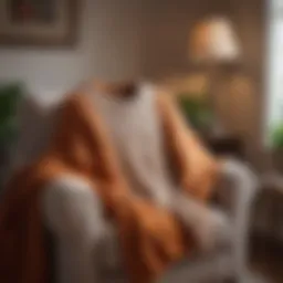 Cozy knitted sweater draped over a chair in a warm living room setting