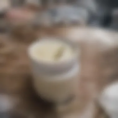 A luxurious jar of homemade yogurt vinaigrette on a rustic wooden table.